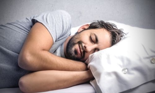 Man Sleeping on bed